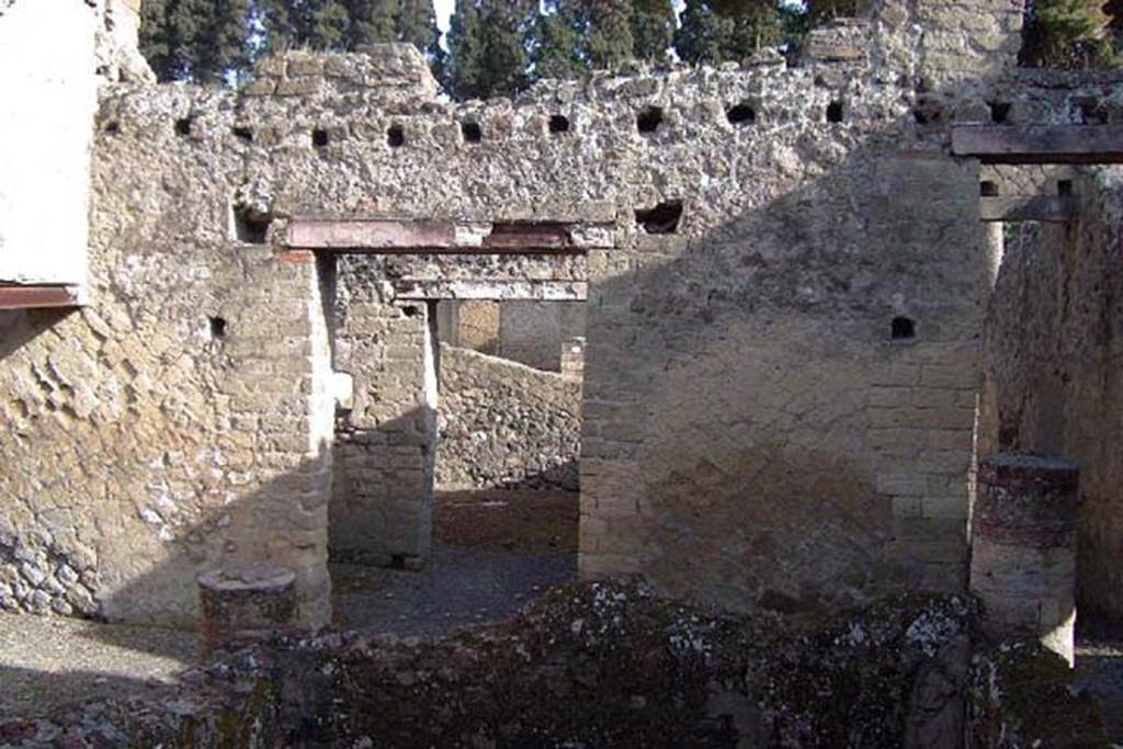 IV.18, Herculaneum, April 2002. Room 11, looking east across the tetrastyle atrium closed by a pluteus or parapet.
The doorway to the vestibule/anteroom of the triclinium is centre left, looking through into the triclinium. The entrance corridor is on the right. Photo courtesy of Nicolas Monteix.